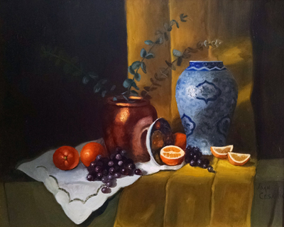 Blue vase and copper pot with fruit.