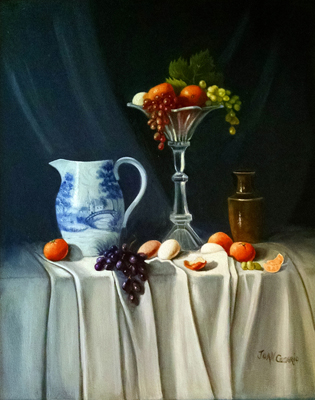 Ceramic pitcher and vase with fruit.