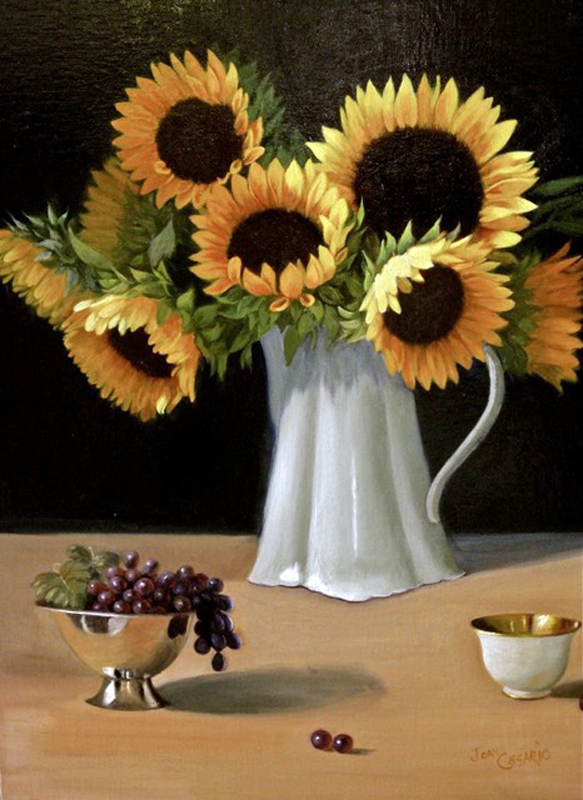 Sunflowers in pitcher with grapes in cups.